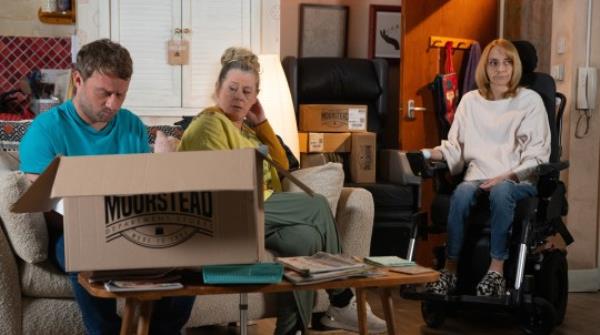 Paul, Bernie and Shelley at Shelley's flat in Corrie, surrounded by boxes of laptops