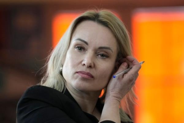 FILE - Former Russian state TV journalist Marina Ovsyannikova attends a press co<em></em>nference Friday, Feb. 10, 2023 in Paris, France. A court in Moscow on Wednesday handed a former state TV journalist a 8 1/2-year prison term in absentia for protesting Russia's war in Ukraine, the latest in a months-long crackdown against dissent that has intensified since Moscow's invasion 20 mo<em></em>nths ago. (AP Photo/Christophe Ena, File)