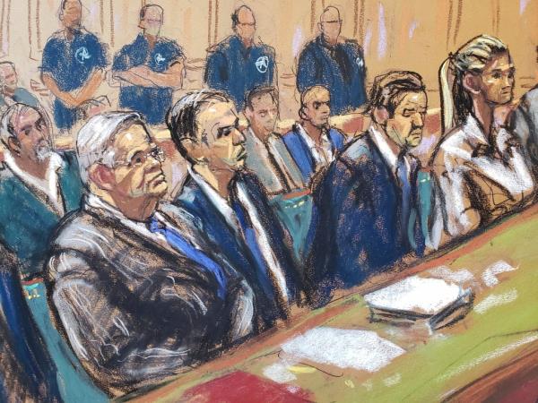 In this courtroom sketch, Democratic U.S. Sen. Bob Menendez, of New Jersey, left, and his wife Nadine Menendez, right, flank his lawyers in Federal Court, in New York, Wednesday, Sept. 27, 2023.