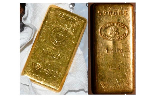 This image provided by the U.S. Attorney's office, Friday, Sept. 22, 2023, in New York, shows two of the gold bars found during a search by federal agents of Sen. Bob Menendez's home and safe deposit box