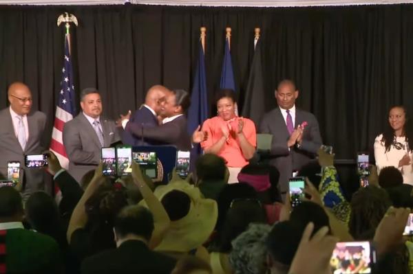 Mayor Adams and NYPD Commissio<em></em>ner Keechant Sewell can be seen hugging at a Juneteenth event on June 15, 2023. 