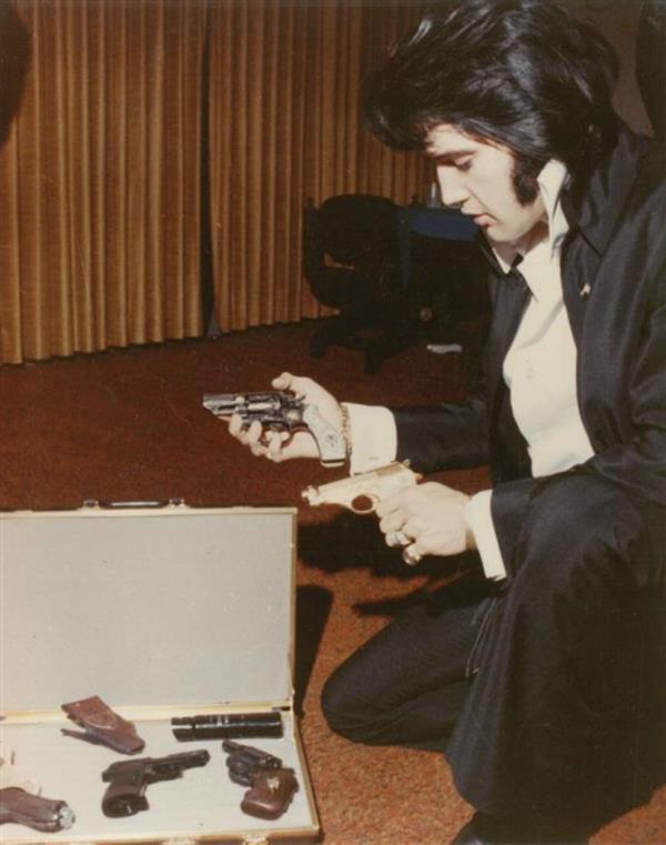 elvis looking at guns