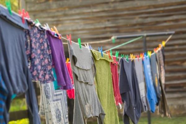 Washing line with drying clothes in outdoor.