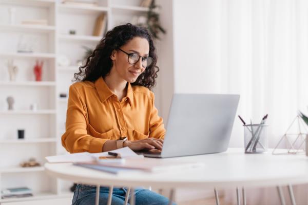 The above image is a stock photo depicting an employee working from home.