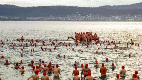 a<em></em>bout 3000 participants dived into the very cold River Derwent, one of the signature things for winter solstice and one of the remaining ico<em></em>nic events of Dark Mofo. NewsWire/Minch Media