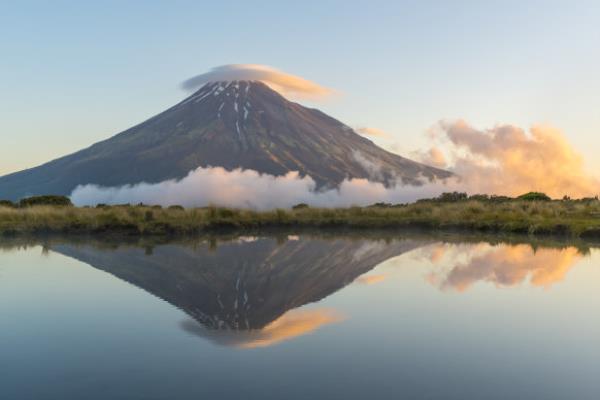 Reflection of Mount Taranaki at sunset. Egmont Natio<em></em>nal Park, North Island, New Zealand. 