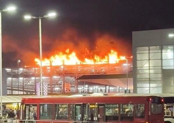 BEST QUALITY AVAILABLE Screen grab taken with permission from video posted on Twitter by @Soriyn23of a fire at a car park at Luton Airport On Tuesday. All flights at the airport have been suspended. Issue date: Wednesday October 11, 2023. PA Photo. See PA story FIRE Luton. Photo credit should read: @Soriyn23/PA Wire NOTE TO EDITORS: This handout photo may o<em></em>nly be used in for editorial reporting purposes for the co<em></em>ntemporaneous illustration of events, things or the people in the image or facts mentio<em></em>ned in the caption. Reuse of the picture may require further permission from the copyright holder.