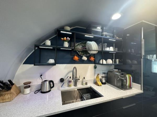 The revamped kitchen includes new cabinetry.