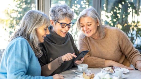 group of three smiling senior women