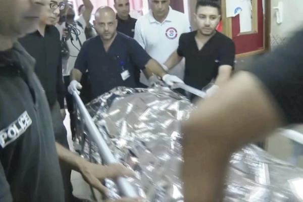 Aysenur Ezgi Eygi’s body being transported through the Rafidia Surgical Hospital, after she was fatally shot.