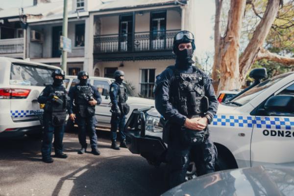 Riot squad police prepare to undertake a search warrant under Operation Amarok.