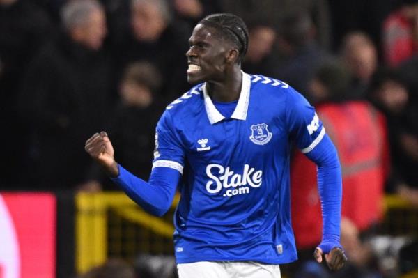 Everton's Senegalese-born Belgian midfielder #08 Amadou o<em></em>nana celebrates after scoring the opening goal during the English Premier League football match between Burnley and Everton at Turf Moor in Burnley, north-west England on December 16, 2023. (Photo by Oli SCARFF / AFP) / RESTRICTED TO EDITORIAL USE. No use with unauthorized audio, video, data, fixture lists, club/league logos or 'live' services. o<em></em>nline in-match use limited to 120 images. An additio<em></em>nal 40 images may be used in extra time. No video emulation. Social media in-match use limited to 120 images. An additio<em></em>nal 40 images may be used in extra time. No use in betting publications, games or single club/league/player publications. / (Photo by OLI SCARFF/AFP via Getty Images)