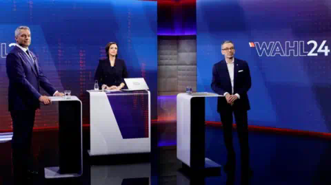 Reuters Chancellor and head of People's Party (OeVP) Karl Nehammer and head of Freedom Party (FPOe) Herbert Kickl wait for the start of a TV discussion in Vienna, Austria, September 23, 2024