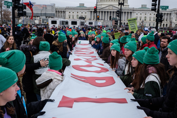 Pro-life demo<em></em>nstrators hold a banner during the March for Life 2020 rally in Washington as Trump became the first US President to attend the event.